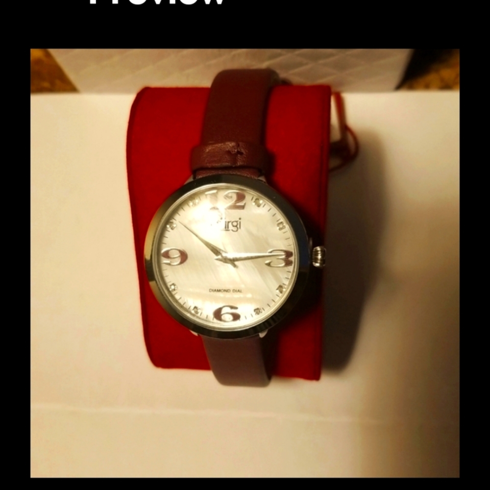 Burgi women's watch, diamond dial, stainless steel back with leather band.